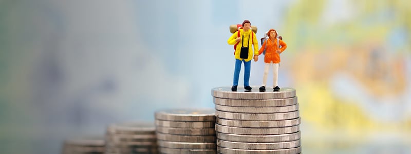 Figures standing on money