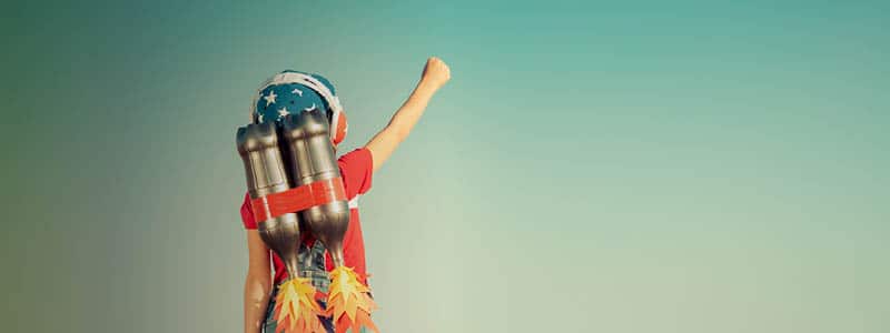 A kid with a rocket backpack