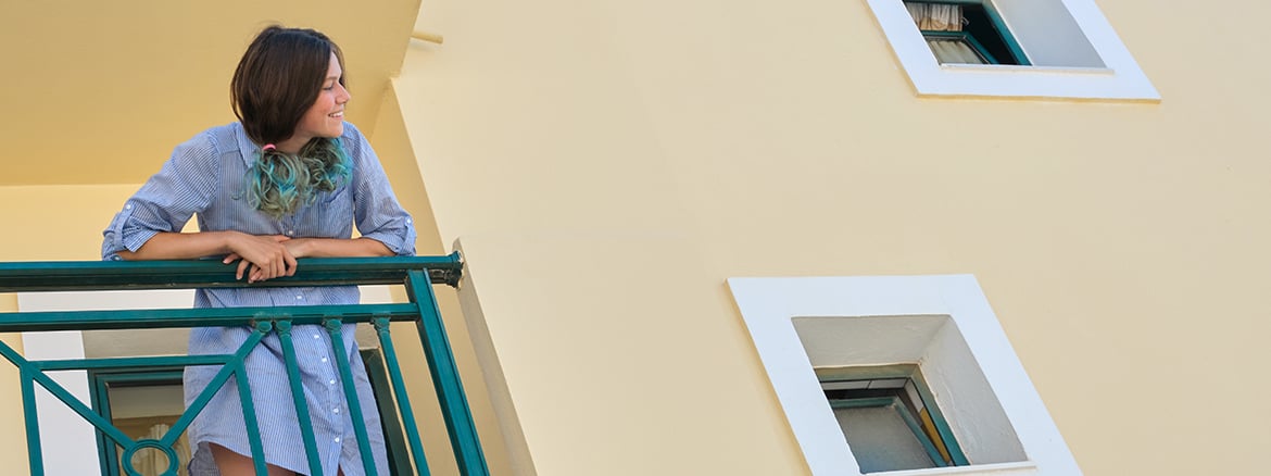 Someone looking out of a balcony