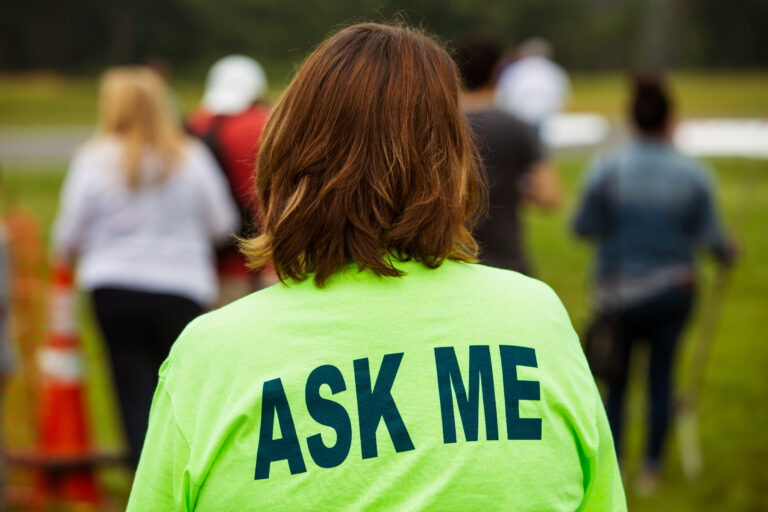 Event volunteer in neon