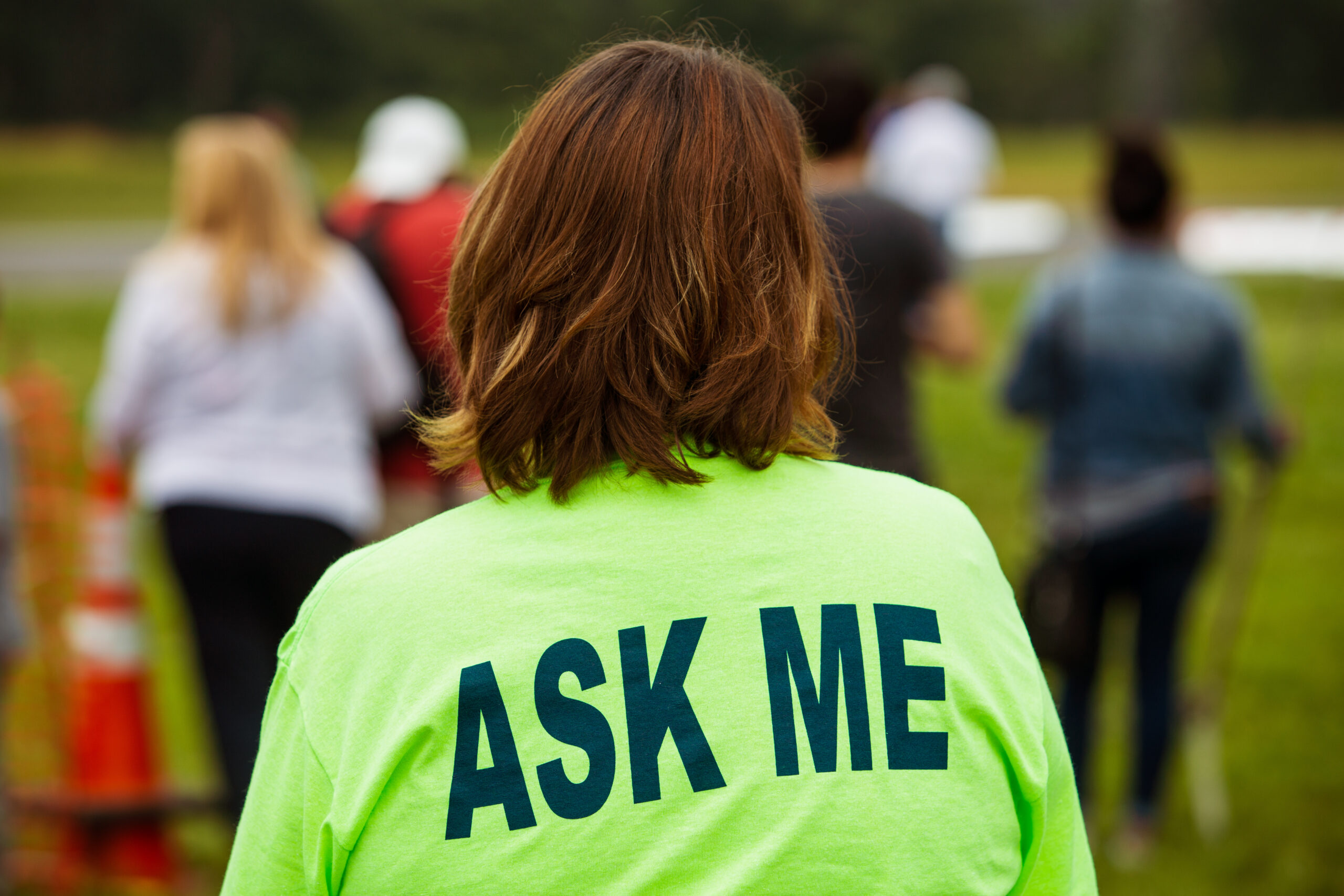 Event volunteer in neon