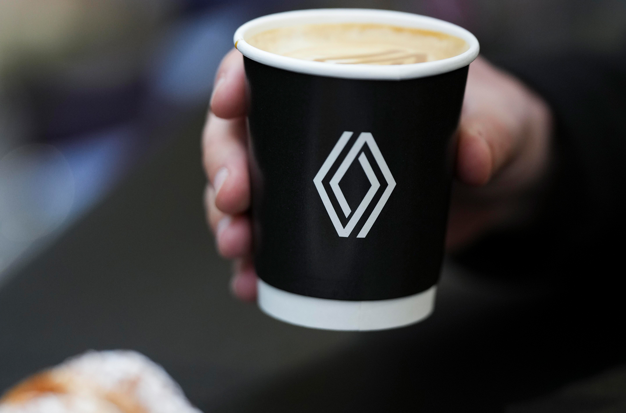A coffee cup with a Renault logo at CV Show at The NEC