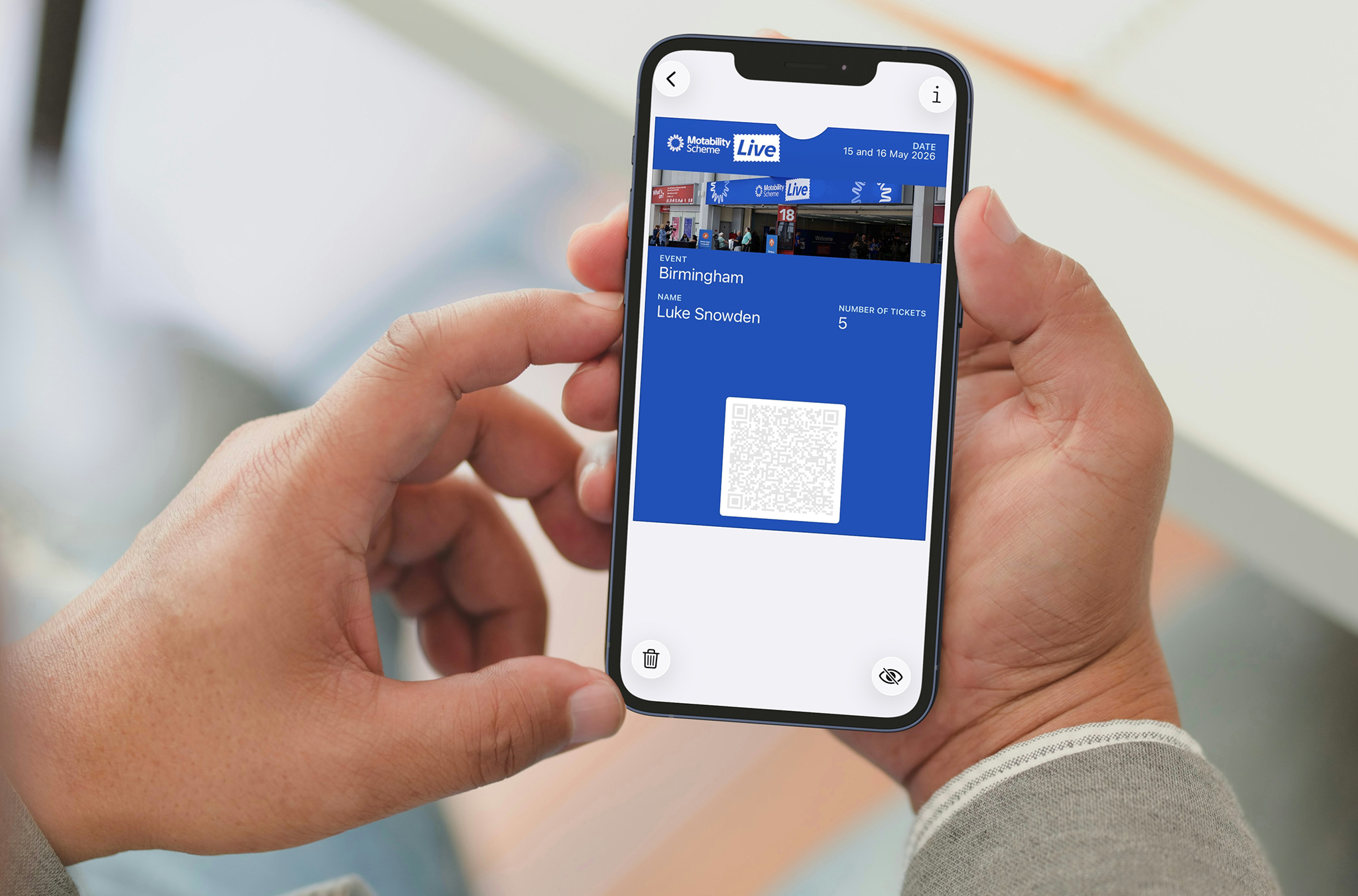 A man looking at a digital event ticket on a smart phone